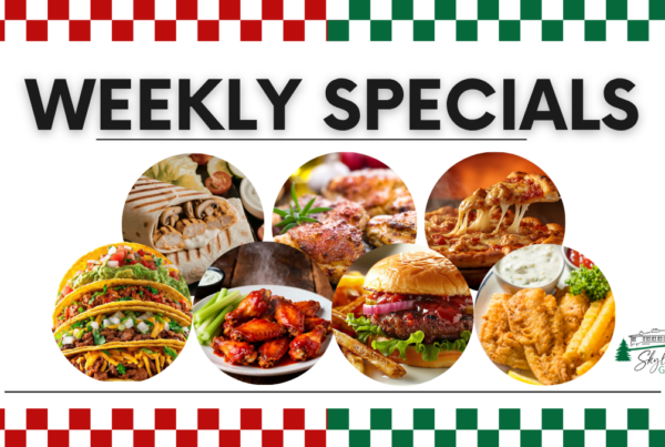 A promotional banner for Skyline Golf Club titled "WEEKLY SPECIALS". The image features a vibrant collage of food items in circular frames, including tacos, a grilled wrap, seasoned chicken, pepperoni pizza, buffalo wings with celery, a gourmet burger with fries, and a fish fry platter. The top and bottom of the image are bordered by red and green checkered patterns.